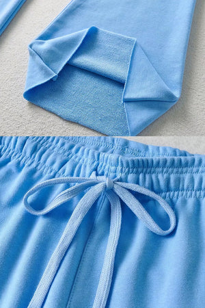 Light blue comfy wide-leg pants with elastic waistband and drawstring closure made from breathable sustainable fabric