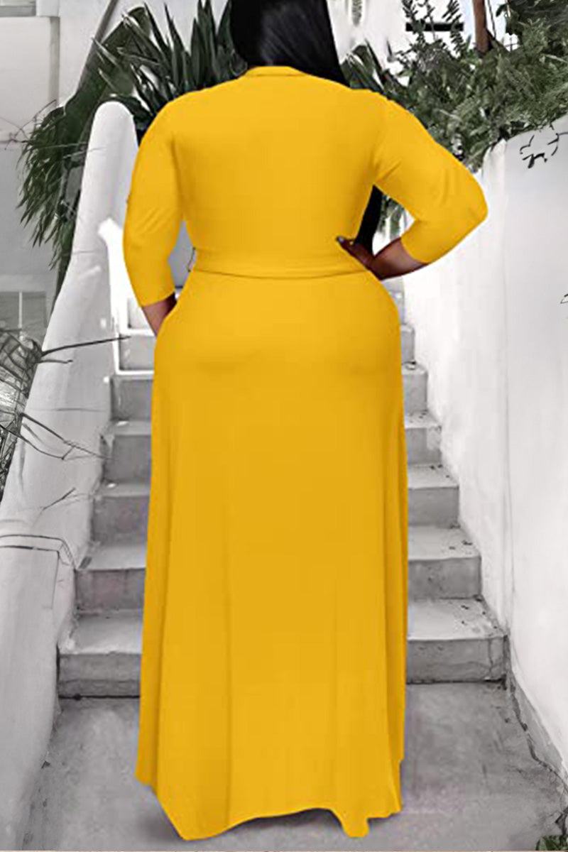 Plus size yellow belted dress with 3/4 sleeves and swing skirt back view