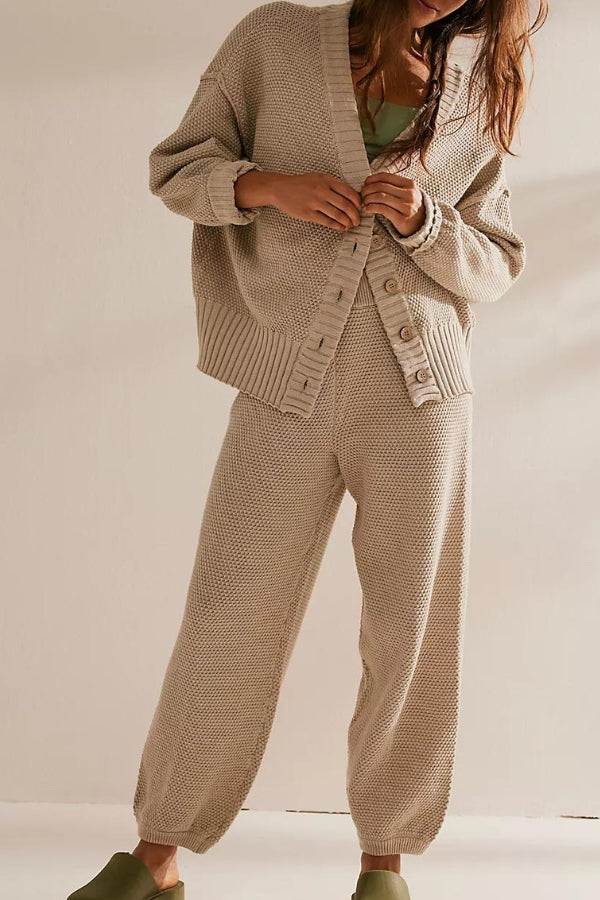 Woman wearing beige two-piece knitwear relaxed co-ord set with oversized cardigan and matching pants.