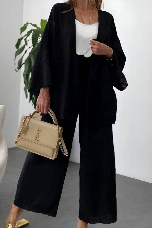 Black Chic Comfort Kimono two-piece set with wide-leg pants and loose kimono jacket, styled with white top and beige handbag
