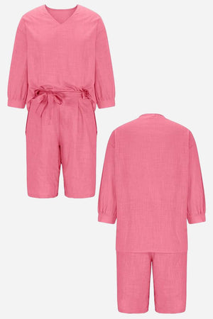 Pink two-piece set with loose long-sleeve shirt and high-waisted knee-length shorts in breathable cotton fabric