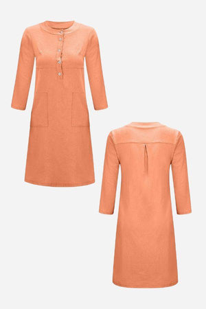 Orange cotton dress with half-button front, 3/4 rolled sleeves, knee-length, and front pockets, shown from front and back.