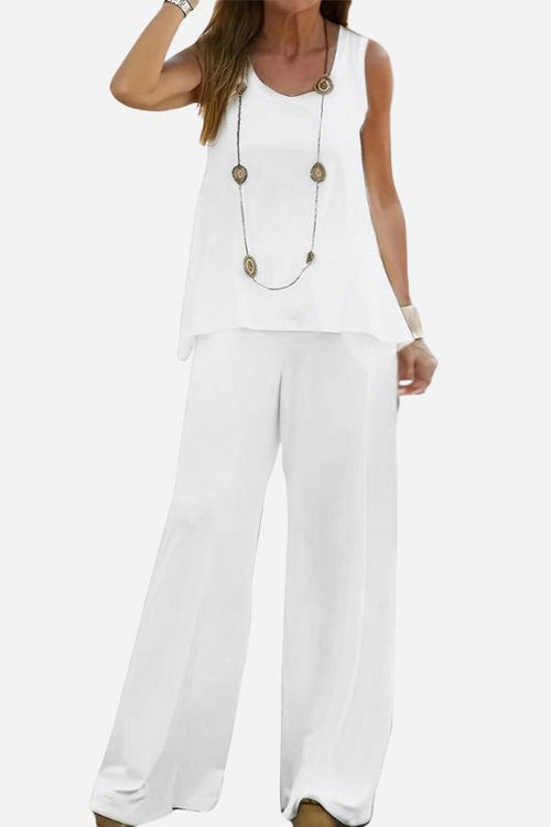 White two-piece co-ord outfit designed to balance apple-shaped body with sleeveless blouse and wide-leg trousers.