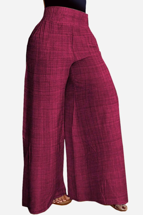 High waist wide leg pants in textured burgundy fabric with relaxed fit and elastic waistband