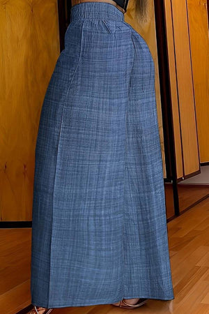 High waist wide leg pants in lightweight blue fabric with elastic waistband and relaxed fit