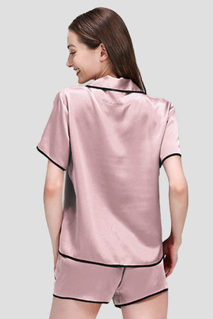 Back view of pink Mulberry Silk Hemd pajama set with black trim on model