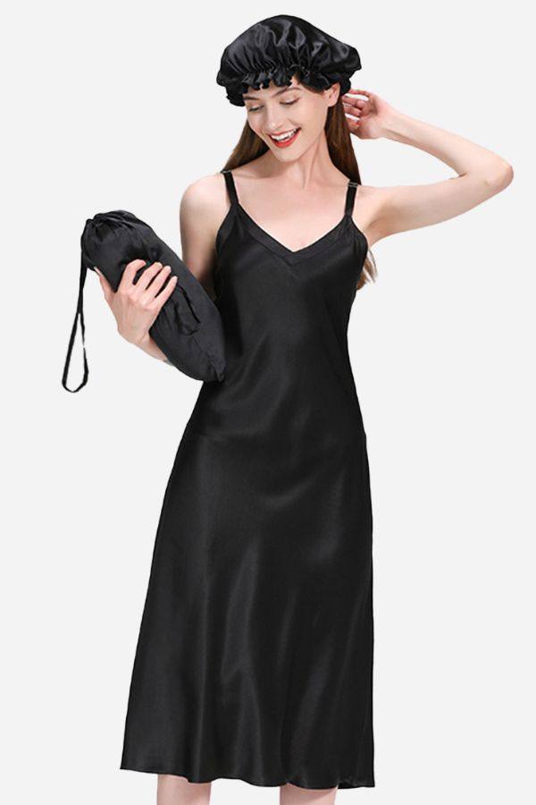 Woman wearing black Mulberry Silk Elegant Night Dress with matching silk bonnet and carrying matching silk pouch