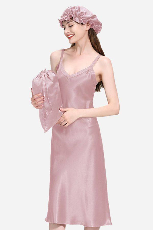 Woman wearing a pink Mulberry Silk Elegant Night Dress with matching cap and pillow cover