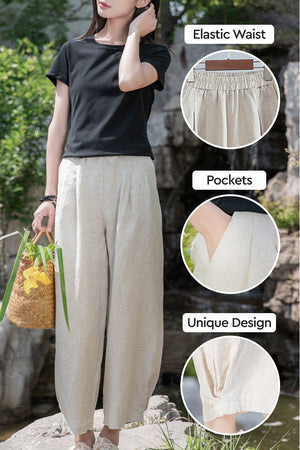 Woman wearing beige Ramie Linen Cotton Pants with elastic waist, pockets, and unique cuff design outdoors