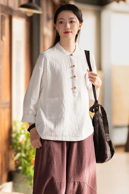 Woman wearing one size fits all ramie linen & cotton blouse with long sleeves and side pocket