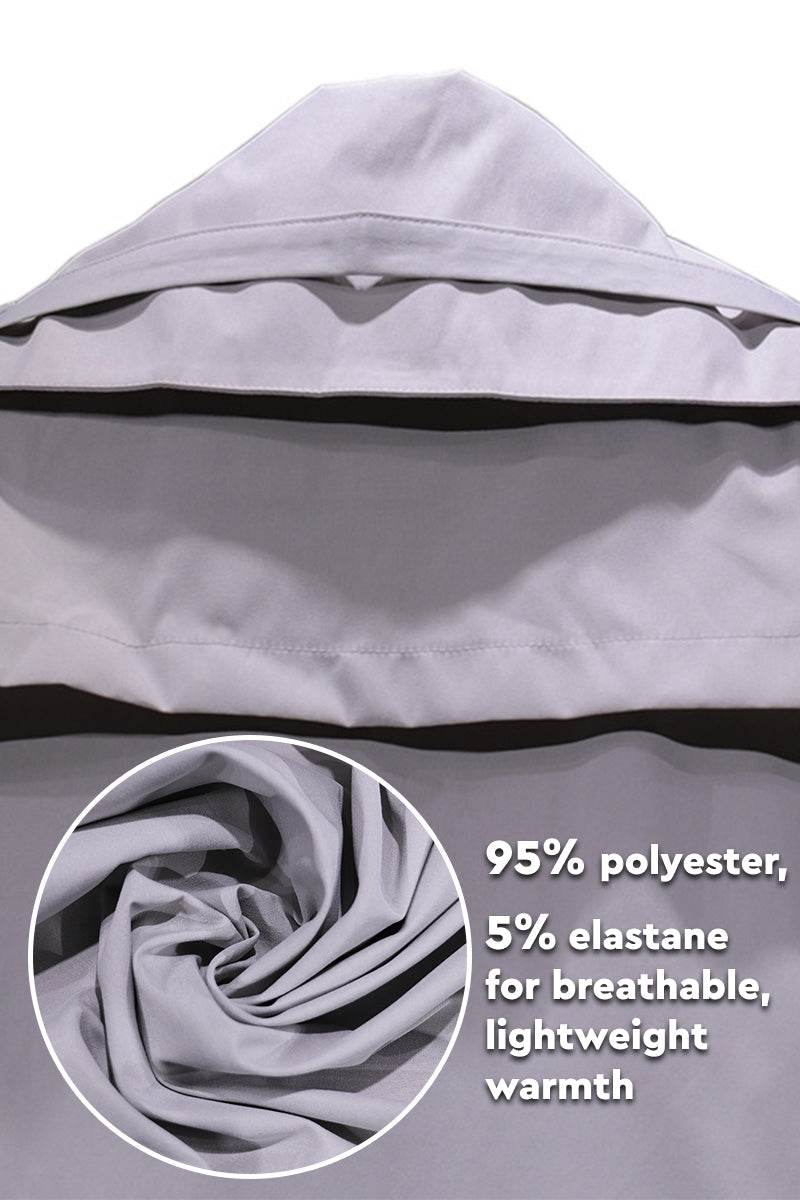 Lightweight minimalist hooded coat made of 95% polyester and 5% elastane for breathable warmth.