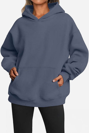 Oversized fleece-lined hoodie in blue with front pocket and relaxed fit for warmth and comfort