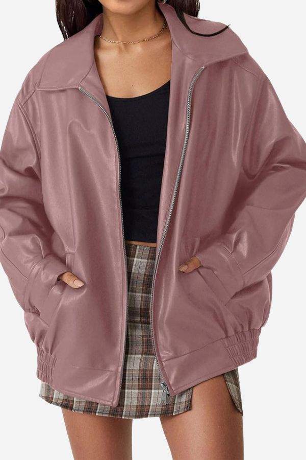Oversized faux leather motorcycle jacket in soft blush pink with zipper front and relaxed fit for layering