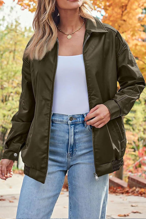 Oversized faux leather motorcycle jacket in olive green with relaxed fit and zipper front
