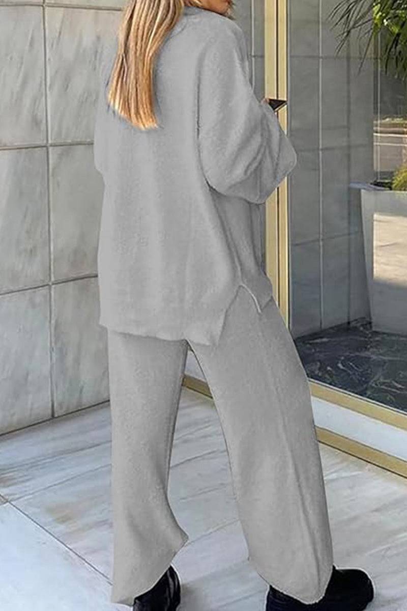 Woman wearing gray Travel-Ease Two-Piece Set with relaxed fit and long sleeves, standing outdoors near glass door