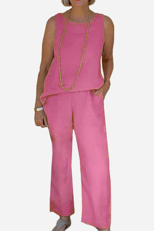 Sleek silhouette pink sleeveless coordinated set with wide-leg pants and lightweight fabric.