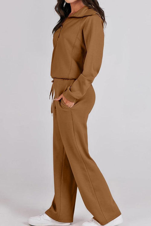 Woman wearing brown Loungewear Buttersoft Tracksuit Set with hoodie and relaxed fit pants.
