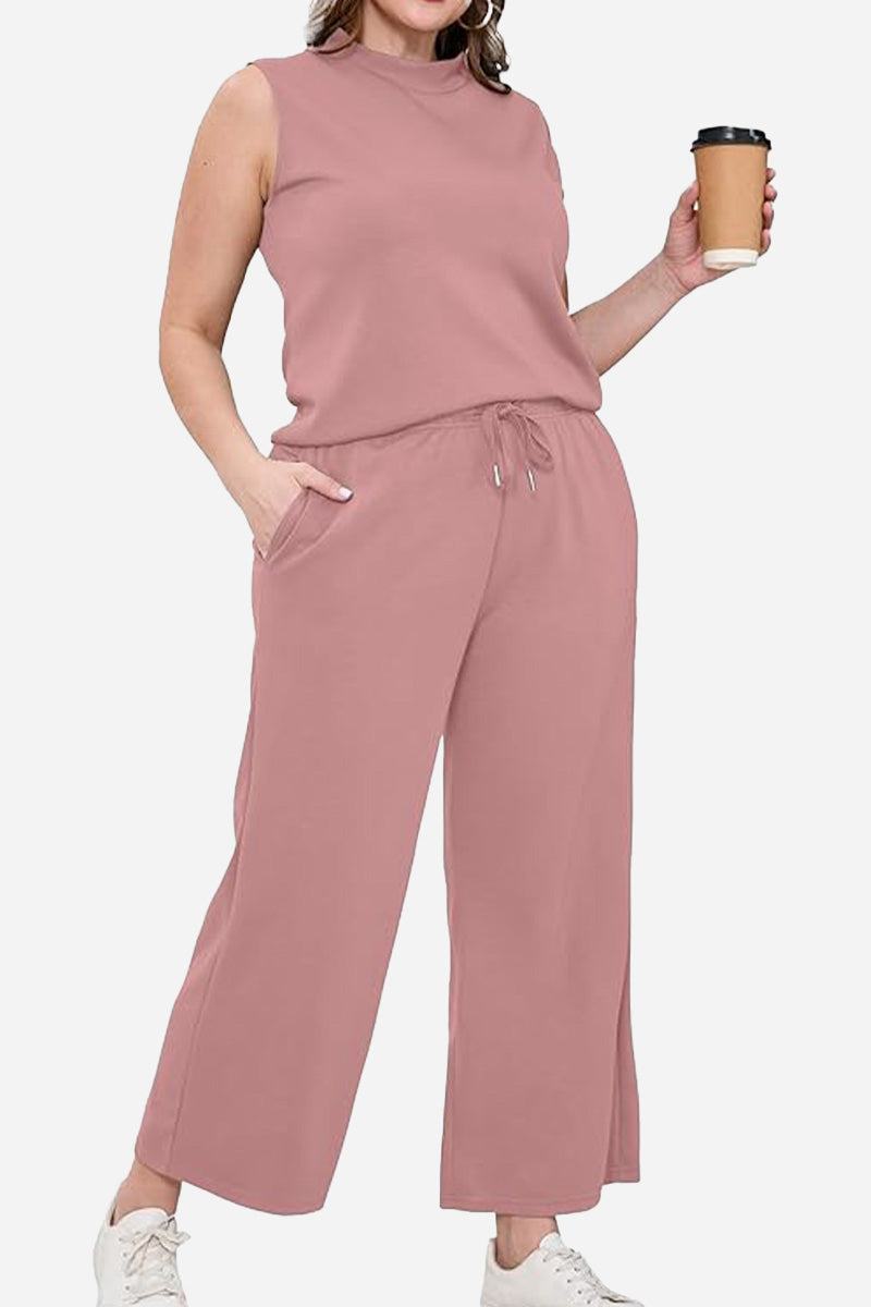 woman wearing cotton chic sleeveless two-piece set in dusty rose holding coffee cup