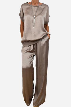 Silken Escape satin two-piece set in taupe with relaxed fit top and wide-leg pants.