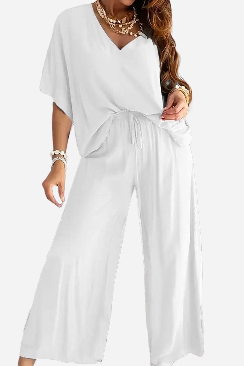White two-piece pantsuit with V-neck top and wide-leg pants, stylish and comfortable polyester set for versatile wear