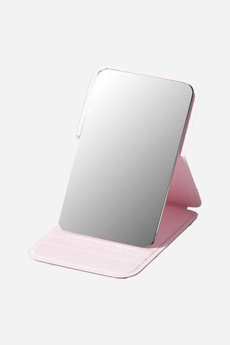 Compact travel pocket mirror with durable pink PU leather case and clear reflective surface for on-the-go touch-ups
