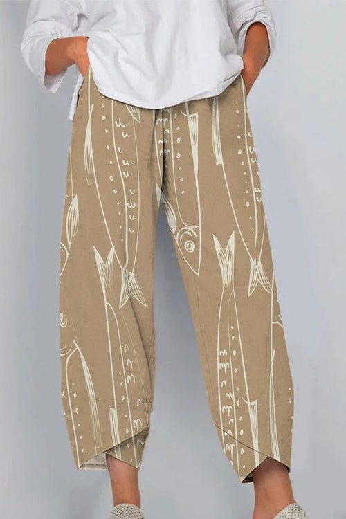 Breathable cropped pants with artistic sardine pattern in beige, comfortable fit with side pockets and casual style