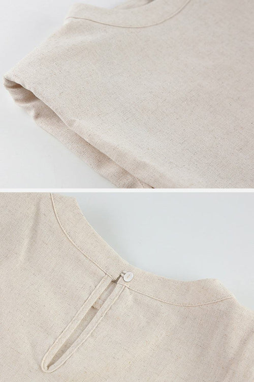 close-up of breathable cotton-linen blend beige fabric two-piece top with sleeveless design and back button closure