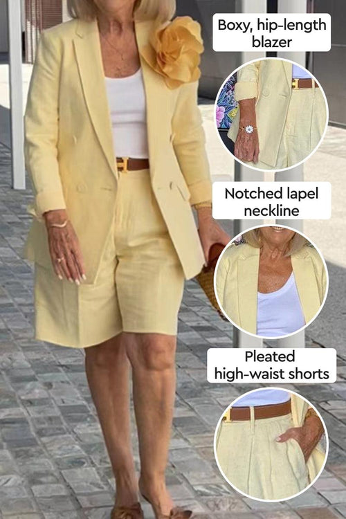Woman wearing stylish blazer and shorts two-piece set in pale yellow with notched lapel and pleated high-waist shorts