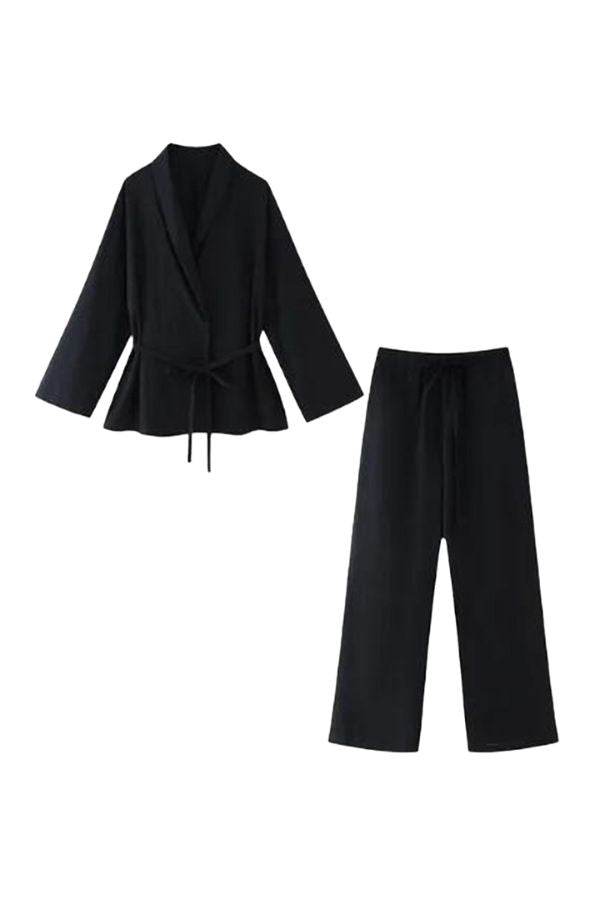 Black mix-match lounge-to-travel set with wide-leg pants and belted draped top in premium polyester