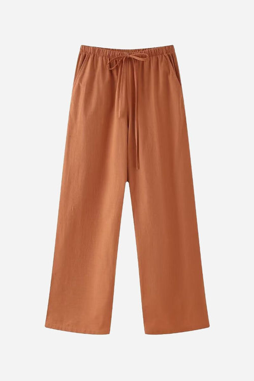 Rusty orange wide-leg pants from versatile Mix-Match Lounge-to-Travel Set, comfortable and stylish for travel and casual wear.