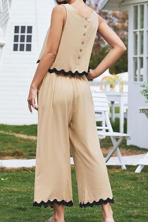Beige scalloped trim sleeveless top and wide leg pants set with button back and black trim detail