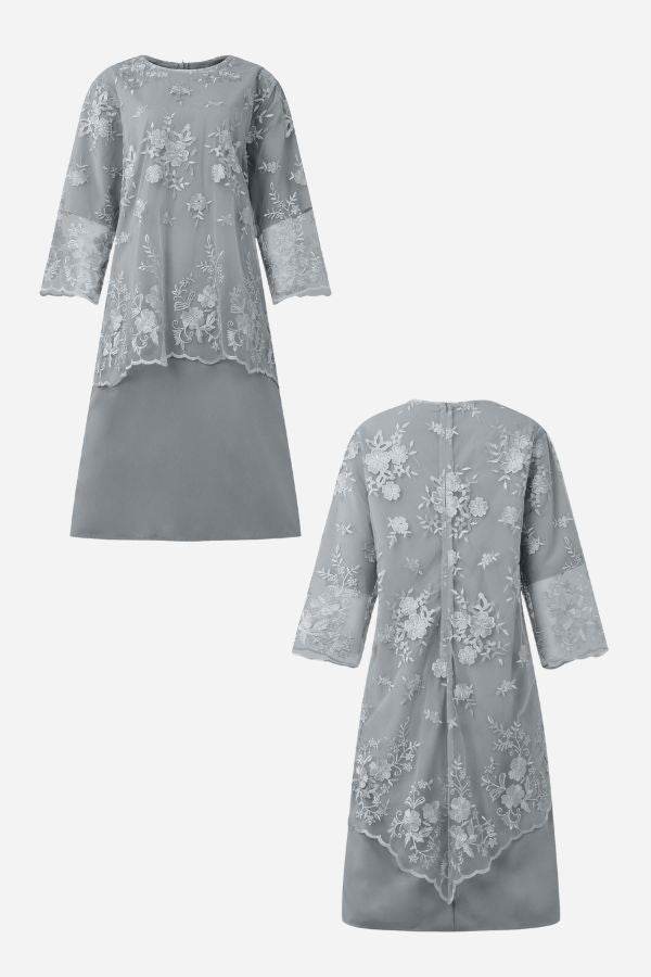Grey two-piece evening dress with elegant lace details and floral embroidery, featuring a high-low hem and flowing fabric.