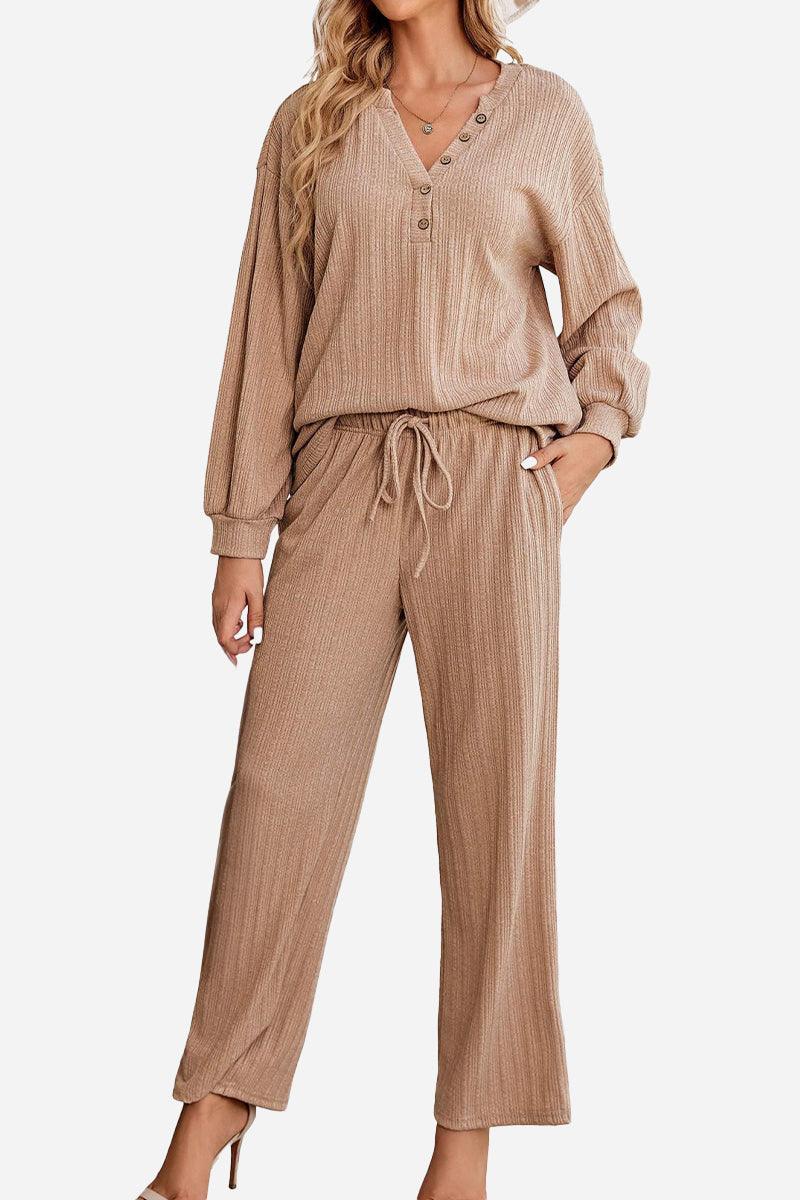 Woman wearing Desert Bloom Ribbed Comfort Set in beige ribbed fabric with a V-neck top and wide-leg pants