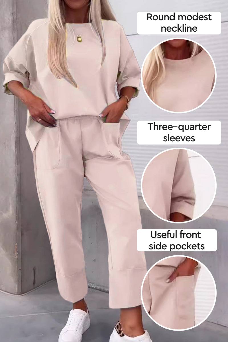 Beige two-piece set with round modest neckline, three-quarter sleeves, and front side pockets, styled with white sneakers.