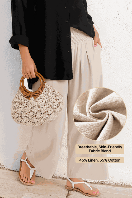 Woman wearing Oversized Linen Leaved-IN Set with breathable linen-cotton blend pants and black oversized shirt holding wicker handbag