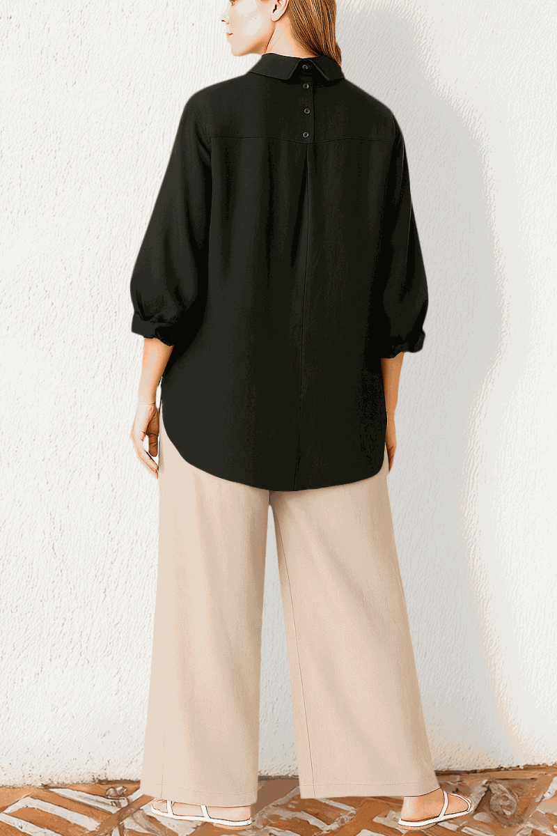 Woman wearing black oversized linen blend shirt and beige palazzo pants from Oversized Linen Leaved-IN Set side view