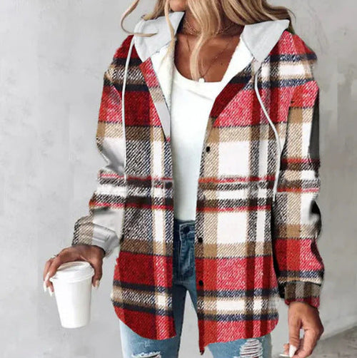 Woman wearing red and brown Highland Plaid Shacket with hood, holding a white cup, styled casually with white top and jeans