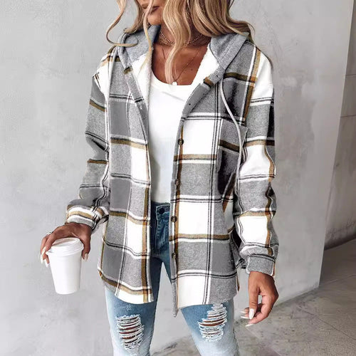Highland Plaid Shacket with soft fleece lining, hood, button-front, front pockets, and relaxed fit in grey and white plaid pattern.