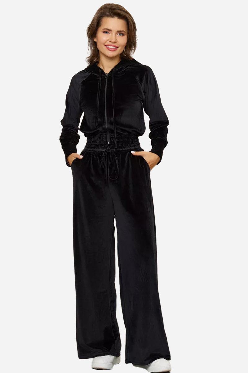 Black velour tracksuit with cropped hoodie and high-waist wide-leg pants, soft and plush fabric.