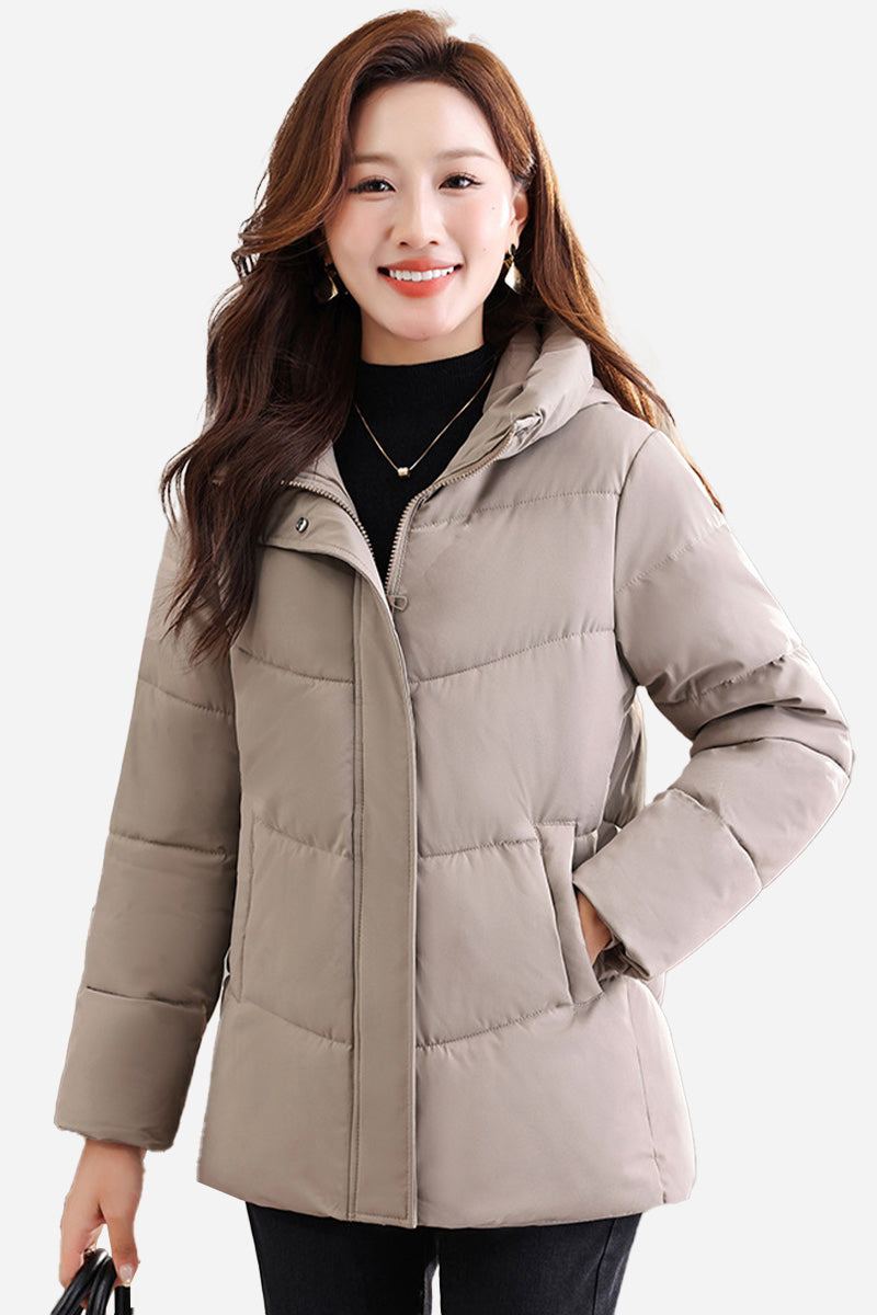 Mid-length Everyday Warmth Coat in beige with hood and side pockets, worn by smiling woman