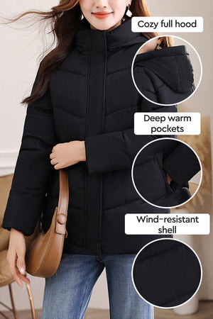 Black Everyday Warmth Coat mid-length with cozy hood, deep warm pockets, and wind-resistant shell for lightweight winter insulation