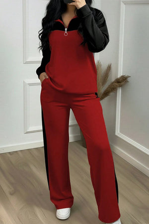 Woman wearing Colorblock Comfort Leisure Set with red and black wide-leg pants and half-zip top