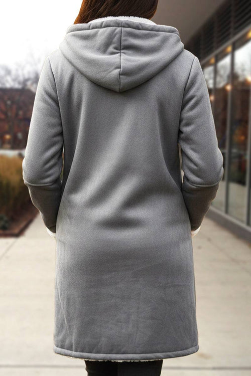 gray warm toggle button hooded coat with sherpa lining on model outdoors