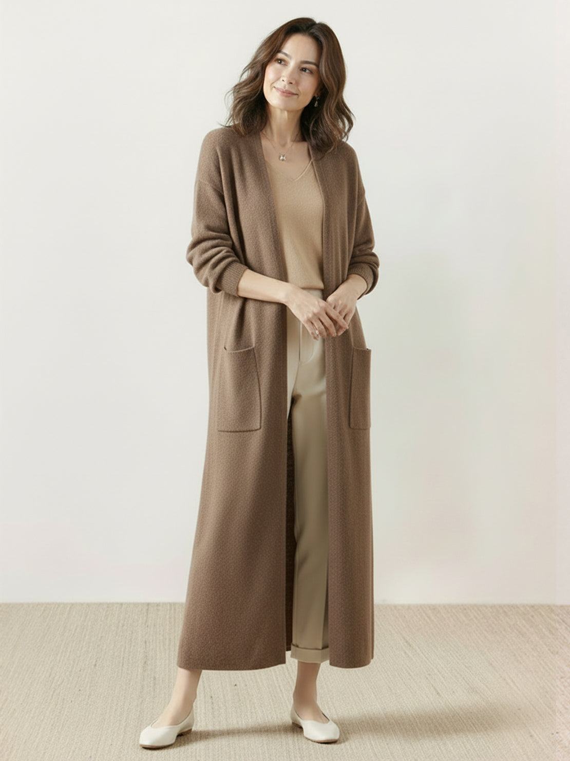 100% Australian Merino Wool longline open-front cardigan with front pockets and ribbed cuffs