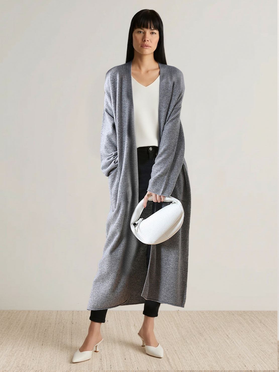 100% Australian Merino Wool long open-front cardigan with knee-length fit and front patch pockets