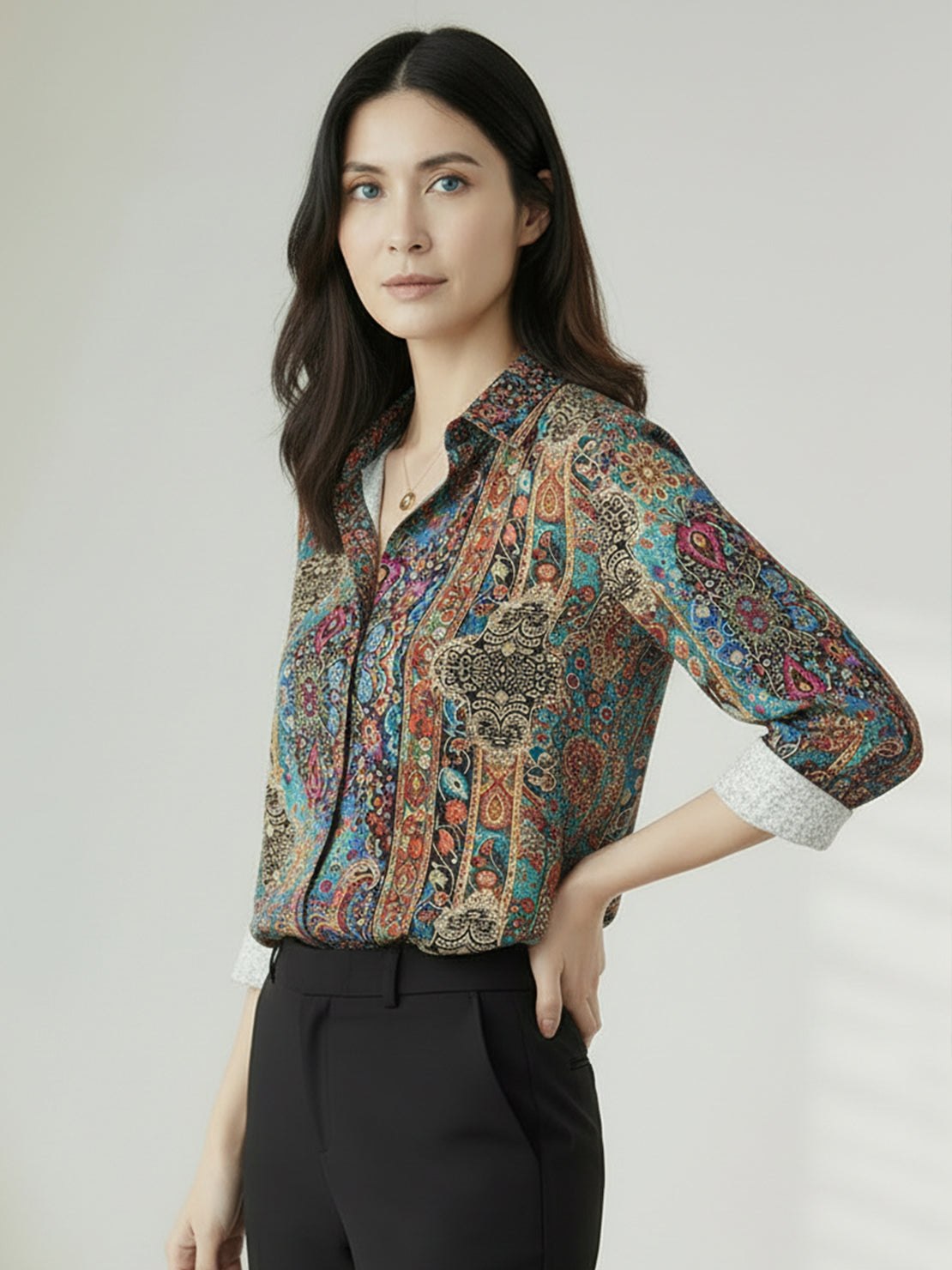 Floral button-down shirt with long roll-up sleeves and relaxed hip-length fit