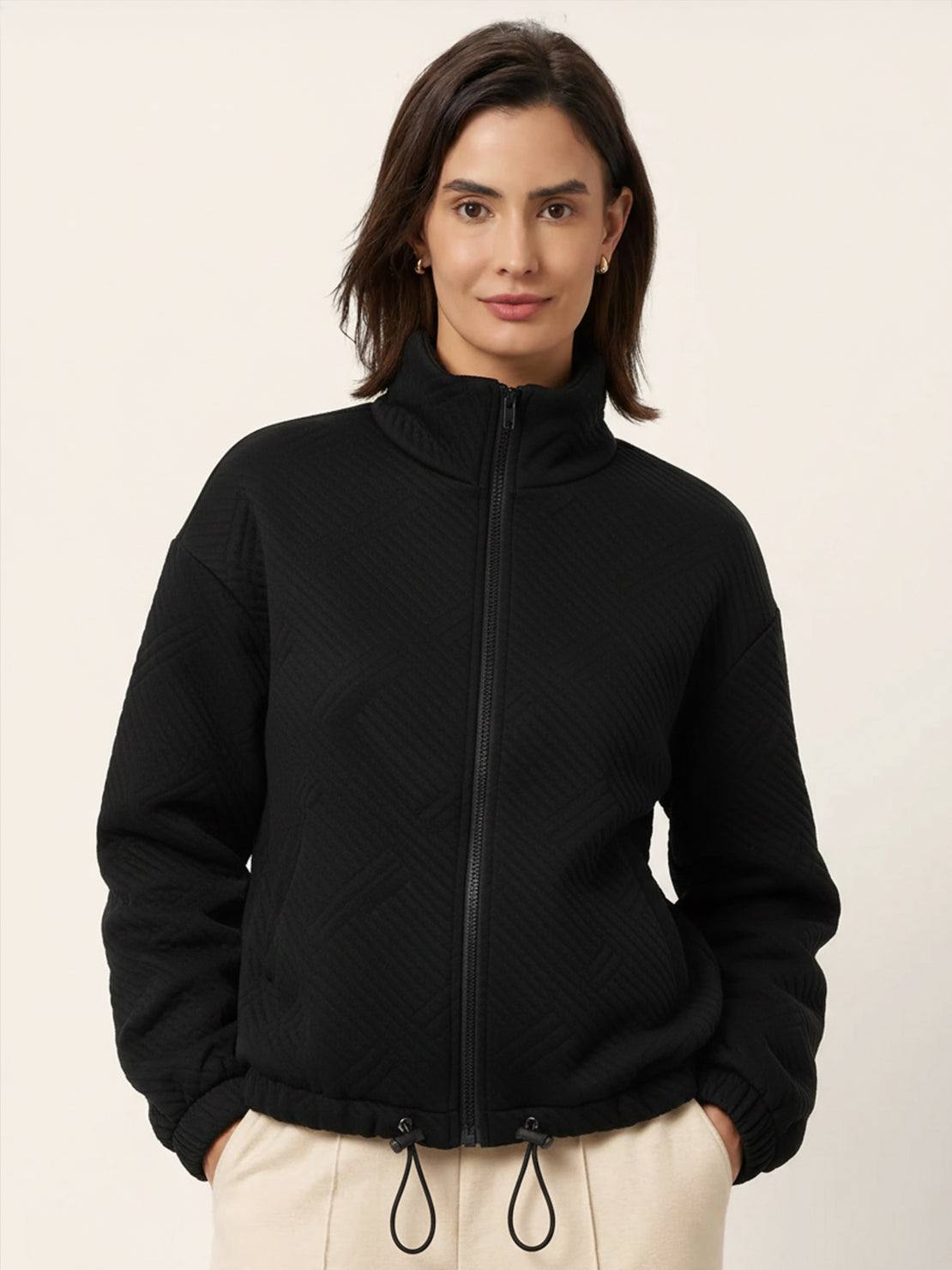 Cropped textured baseball jacket with full zipper, stand collar, elastic cuffs, and waistband.