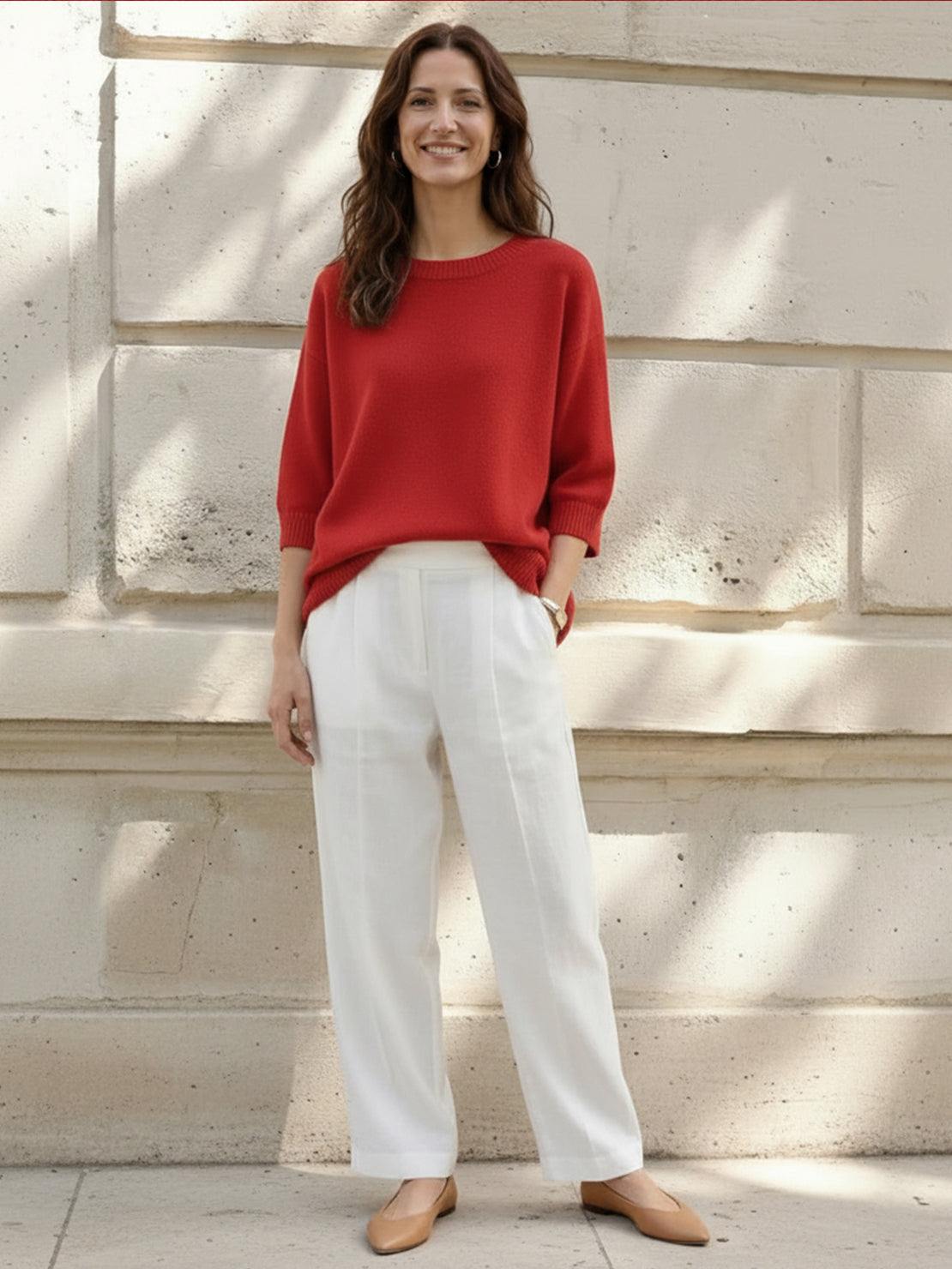 Oversized crew neck knit sweater with drop-shoulder sleeves and ribbed cuffs in neutral color