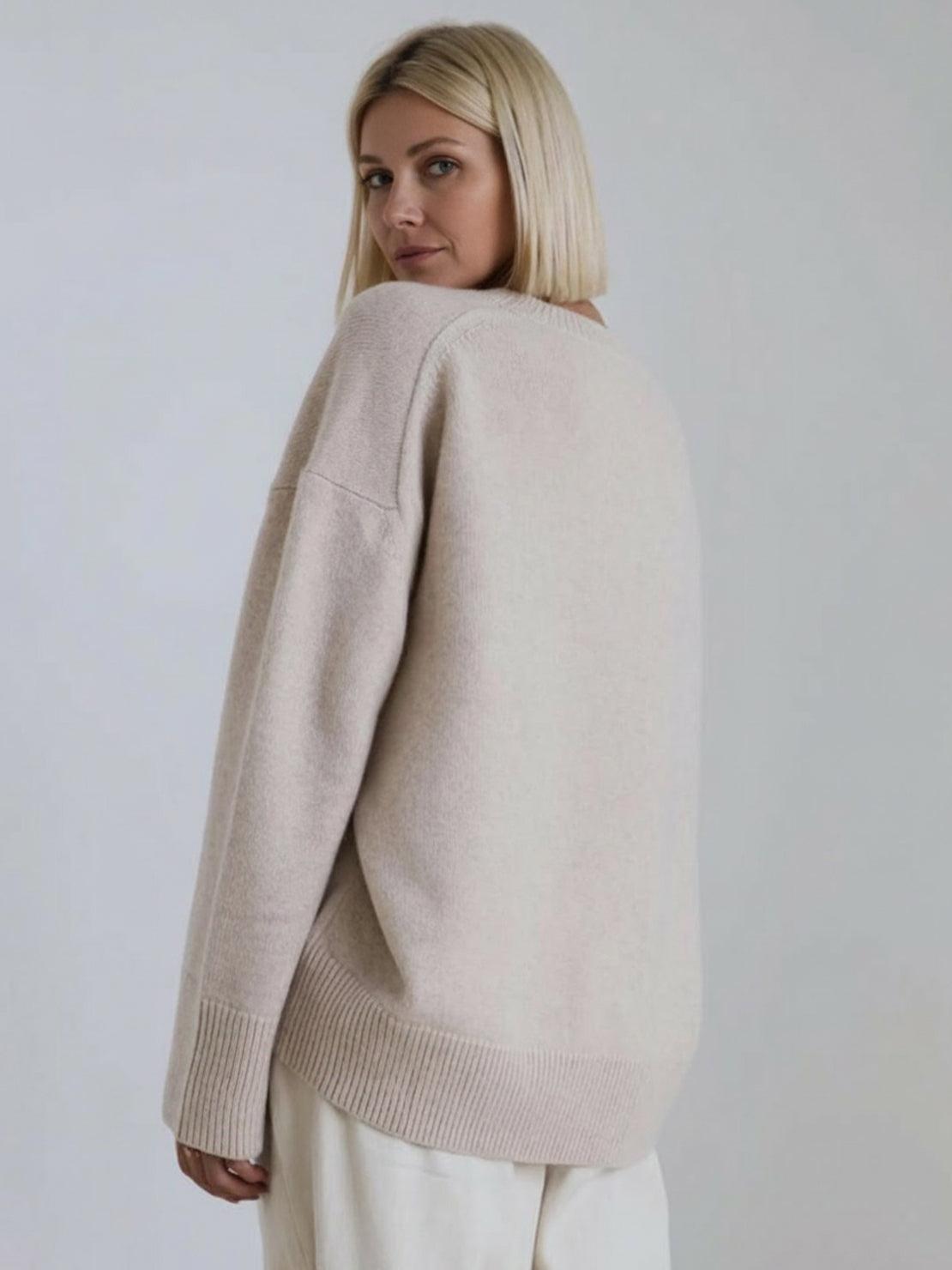 oversized crew neck knit sweater with drop shoulders and ribbed cuffs in neutral color
