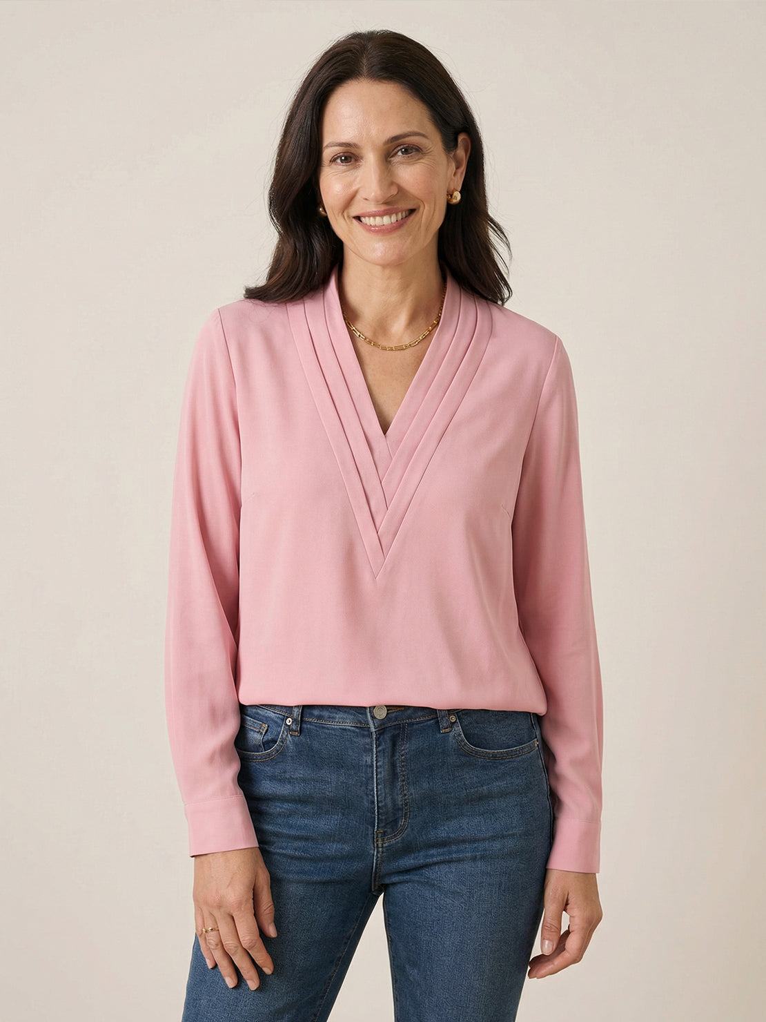 White pleated V-neck long-sleeve blouse with diagonal panel and button cuffs